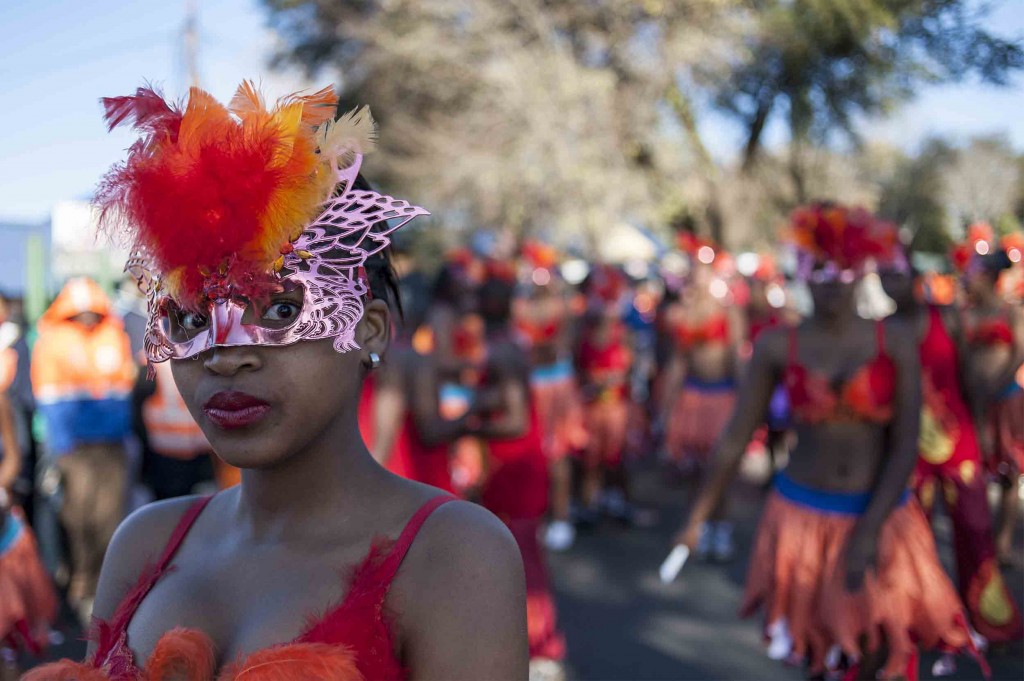A young girl is seen before the start of a parade outside Morris Isaacson High School in Jabavu, Soweto. (Ihsaan Haffejee)
