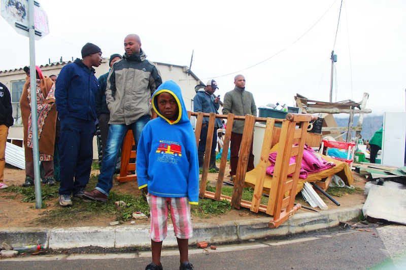 A child is left homeless after the evictions in Lwandle. (Ra'eesa Pather)
