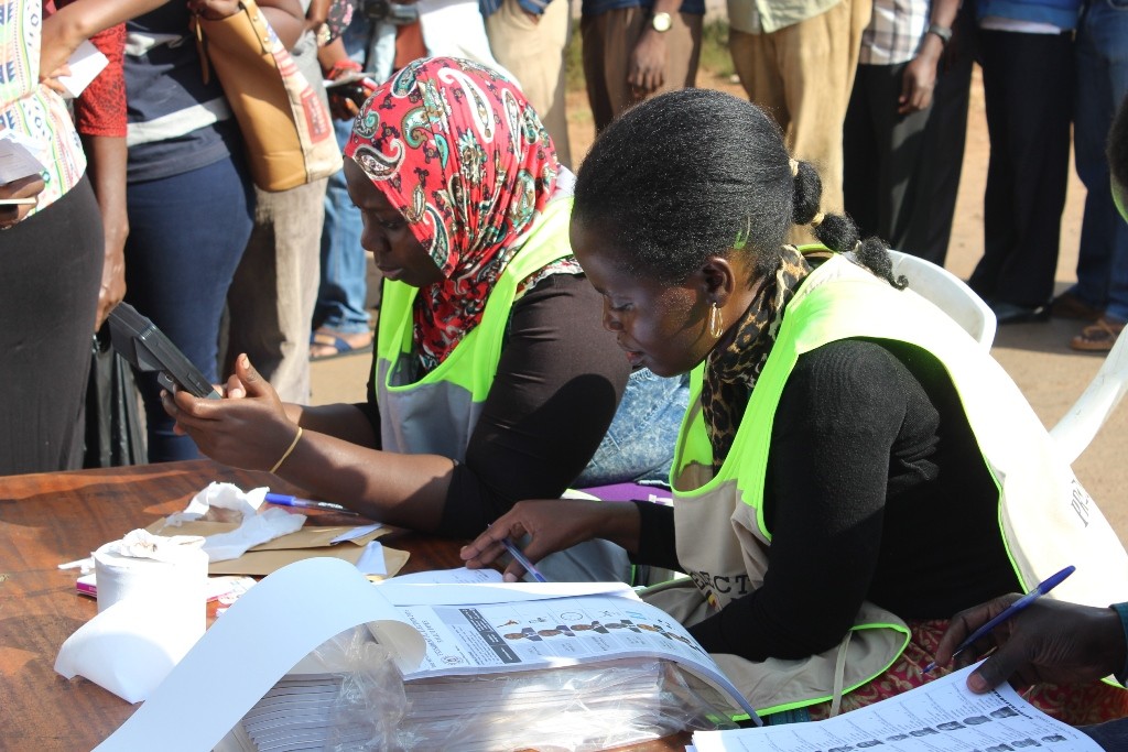 Polling agents searching through the registers at People's Plaza.