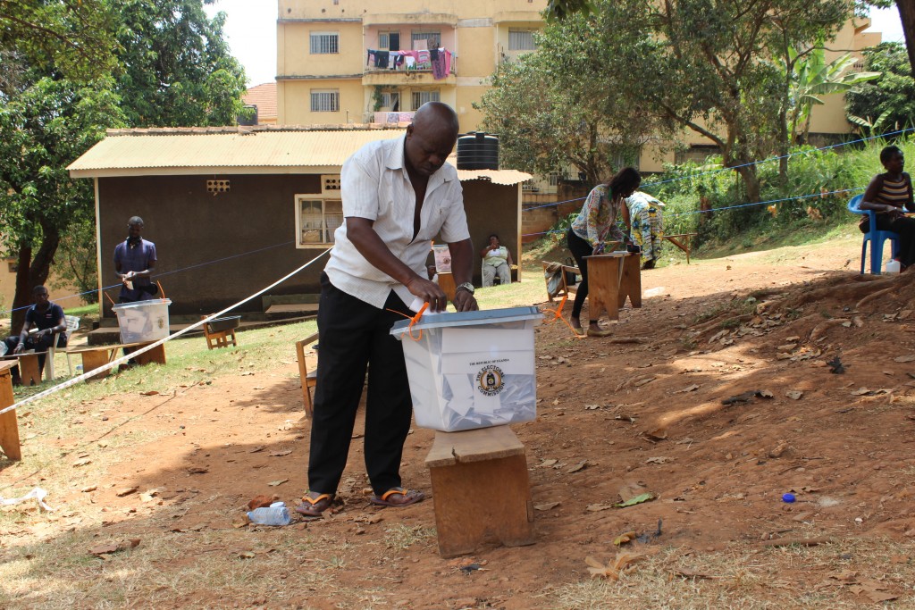 A voter in Mengo, Kampala casts his vote after a grenade exploded here the night before the vote. Mengo has been fairly peaceful and voting began on time however, police are still investigating the explosion which resulted in the death of at least 3 people.