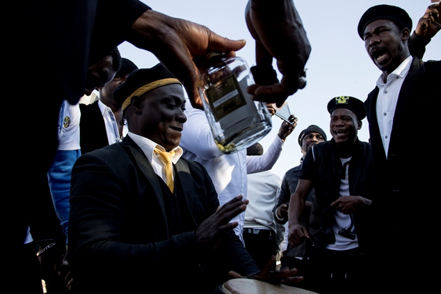 Members of the Neo Black Movement of Africa, a pan africanist organisation originating in Nigeria join in the Youth Day festivities outside the Hector Pieterson memorial site in Soweto. The organisation was involved in mobilising against the Apartheid government in support of black people in South Africa.