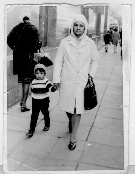 Five years old, walking with my mom down Darling Street in Cape Town.
