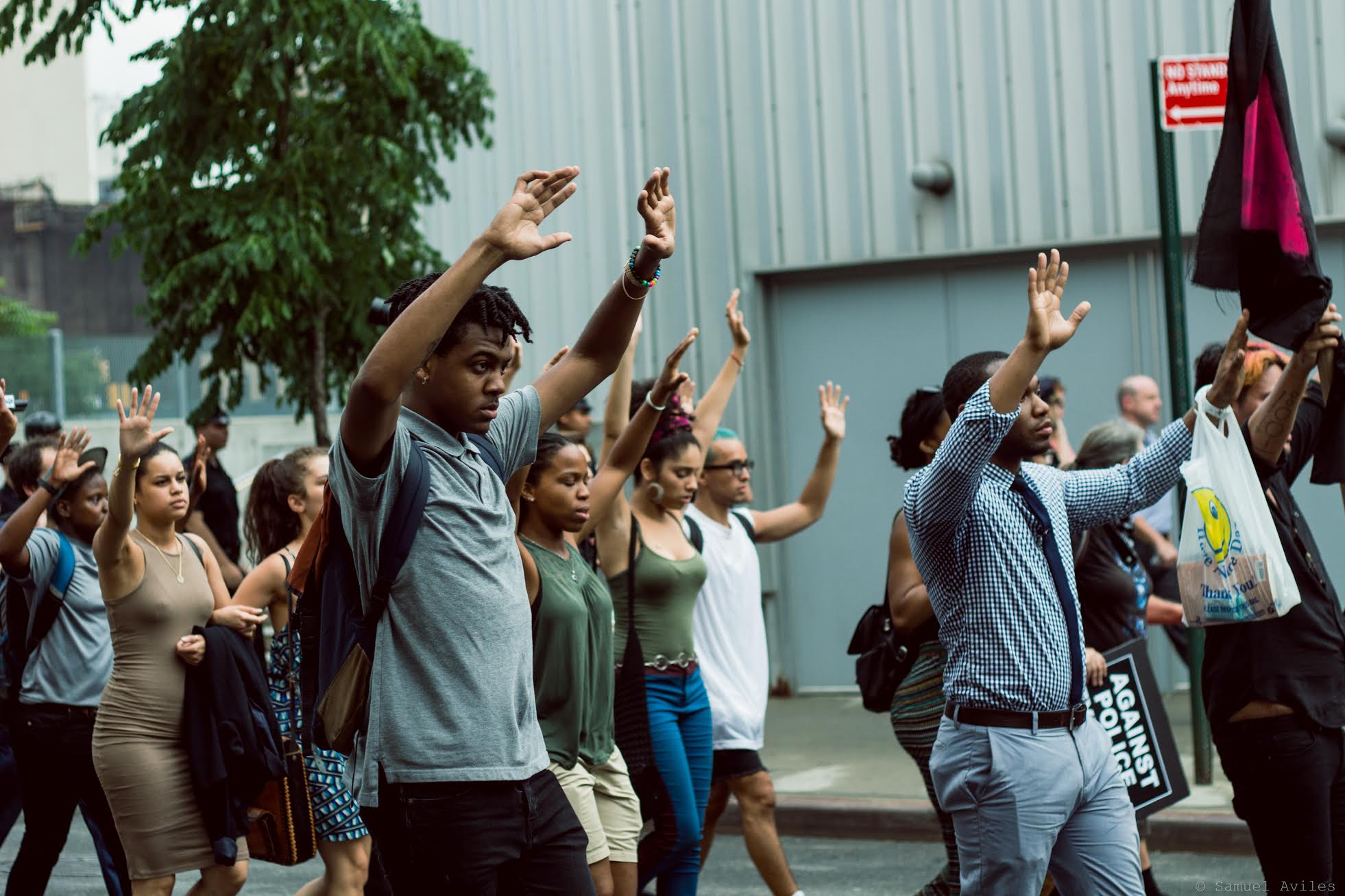 Protestors hold up their hands during the "hands up, don't shoot" chant on July 7th, in Manhattan, New York. The march went through most major areas in Manhattan.