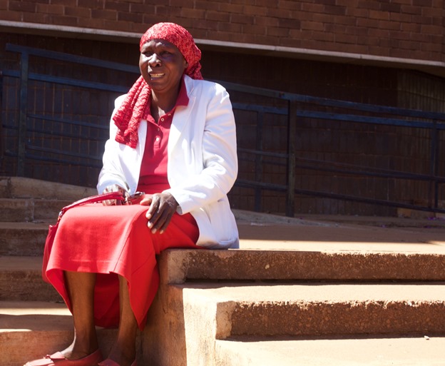  Lilian Chinyerere, a 62 year old supporter of the opposition Movement for Democratic Change (MDC-T) weeps on the steps of Rotten Row Magistrates court after being hit by police as protesters waited to hear the outcome of the court clearance.